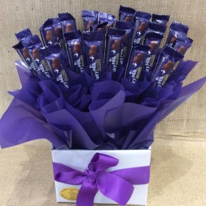 a purple and white chocolate bouquet of dairy milk chocolate