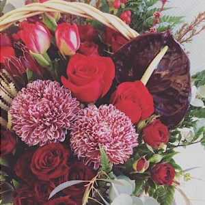 Scarlett Flower Basket is a more modern take on a traditional flower basket in seasonal tones of red - A Touch of Class Florist
