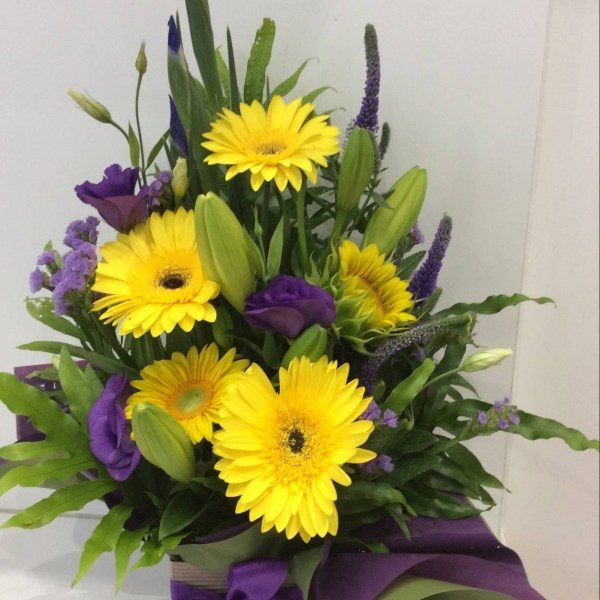 a striking yellow and purple front facing arrangement