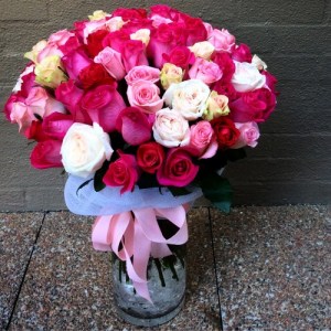 100 roses in shades of pink in a vase- A Touch of Class Florist