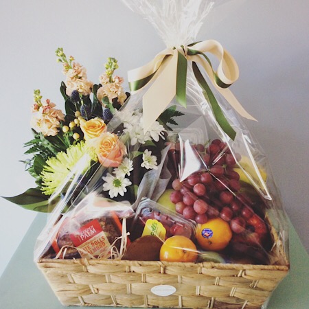 A delightful hamper of fresh fruit and flowers