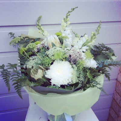 A white and green handtied bouquet of flowers - A Touch of class florist