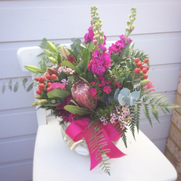 Fantasy fishbowl a red and pink fishbowl vase arrangement- A Touch of Class Florist