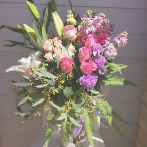 a vase arrangement of highly scdented flowers