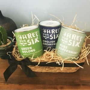A hamper of three tins of Threeonesix Tea presented in a seagrass basket