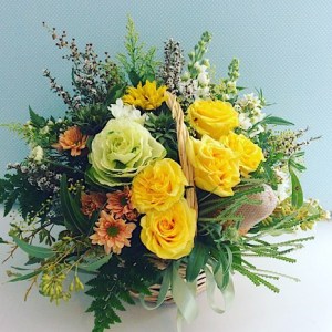 Radiance Flower Basket is a beautiful tradional basket of yellow and golden toned flowers - A Touch of Class Florist