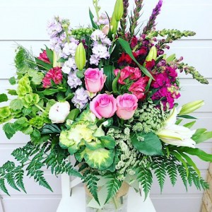 Lush Garden Vase Arrangement is a tall glass vase arrangement full of beautiful garden inspired blooms and foliage - A Touch of Class Florist Perth