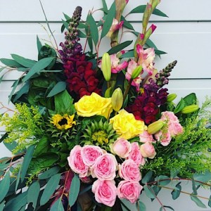 Happiness Hand-tied Bouquet is a cheerful bouquet of seasonal blooms in pinks and yellows - A Touch of Class Florist Perth