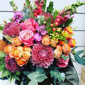 Sunset Luxury Posy Bouquet is a compact hand-tied bouquet full of sunset toned blooms - A Touch of Class Florist Perth