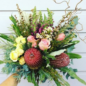 Pretty and Wild Hand-tied Bouquet is a lovely mix of pretty pastel seasonal blooms and Australian Natives - A Touch of Class Florist