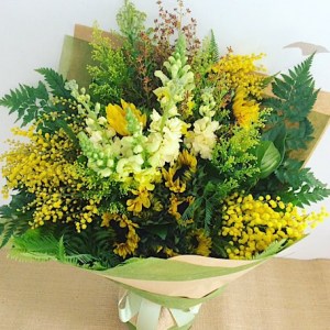 Florist Choice Yellow Hand-tied Bouquet is a joyful bouquet of seasonal yellow blooms - A Touch of Class Florist Perth
