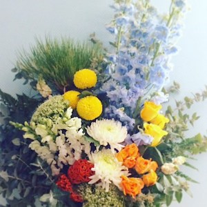 It's a Boy Hand-tied Bouquet uses a mix of seasonal blooms in yellows, blues, greens, white and purples - A Touch of Class Florist Perth