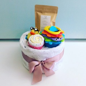 Bath Time Nappy Cake in pinks includes newborn nappies, a baby wrap, a baby bath soak from Salted Bliss, a couple of face washers and a couple of bath time toys - A Touch of Class Florist Perth