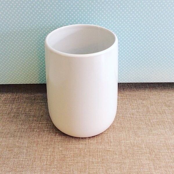 Ceramic Belly Vase is a white ceramic vase approximately 18cm high that is slightly wider at the base - A Touch of Class Florist Perth