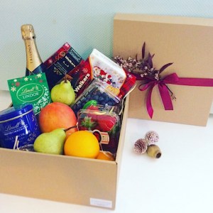 Goodies and Bubbles Christmas Hamper includes sparkling wine, fresh fruit, chocolate and Christmas Sweet treats - A Touch of Class Florist Perth