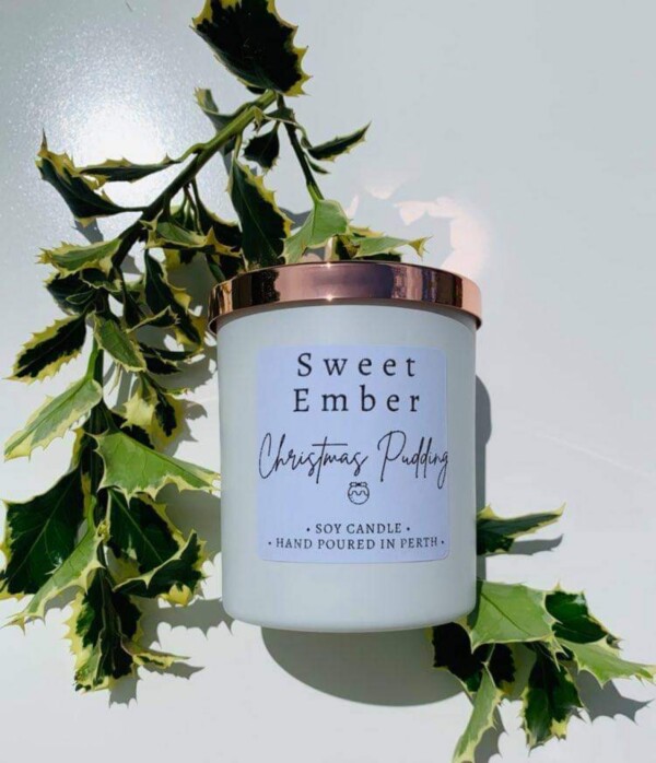 Sweet Ember Soy Candle in Christmas Pudding Scent. Hand poured into a white pot with a rose gold lid. A Touch of class Florist Perth
