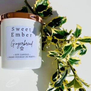 Sweet Ember Soy Candle in Gingerbread scent. In a white pot with a rose gold lid. A Touch of Class Florist Perth