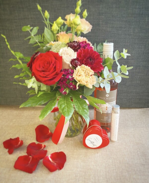 Lover Lover Gift Combination includes a jam jar of seasonal flowers, a bottle of wine, a test tube of salted bliss bath salts and a heart shaped tin candle from Sweet Ember - A touch of class Florist Perth
