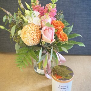 Gift For You White and Rose Gold by A Touch of Class Florist Perth includes a seasonal jam jar of fresh flowers and a Sweet Ember candle, scent will vary, in a white jar with Rose gold lid.